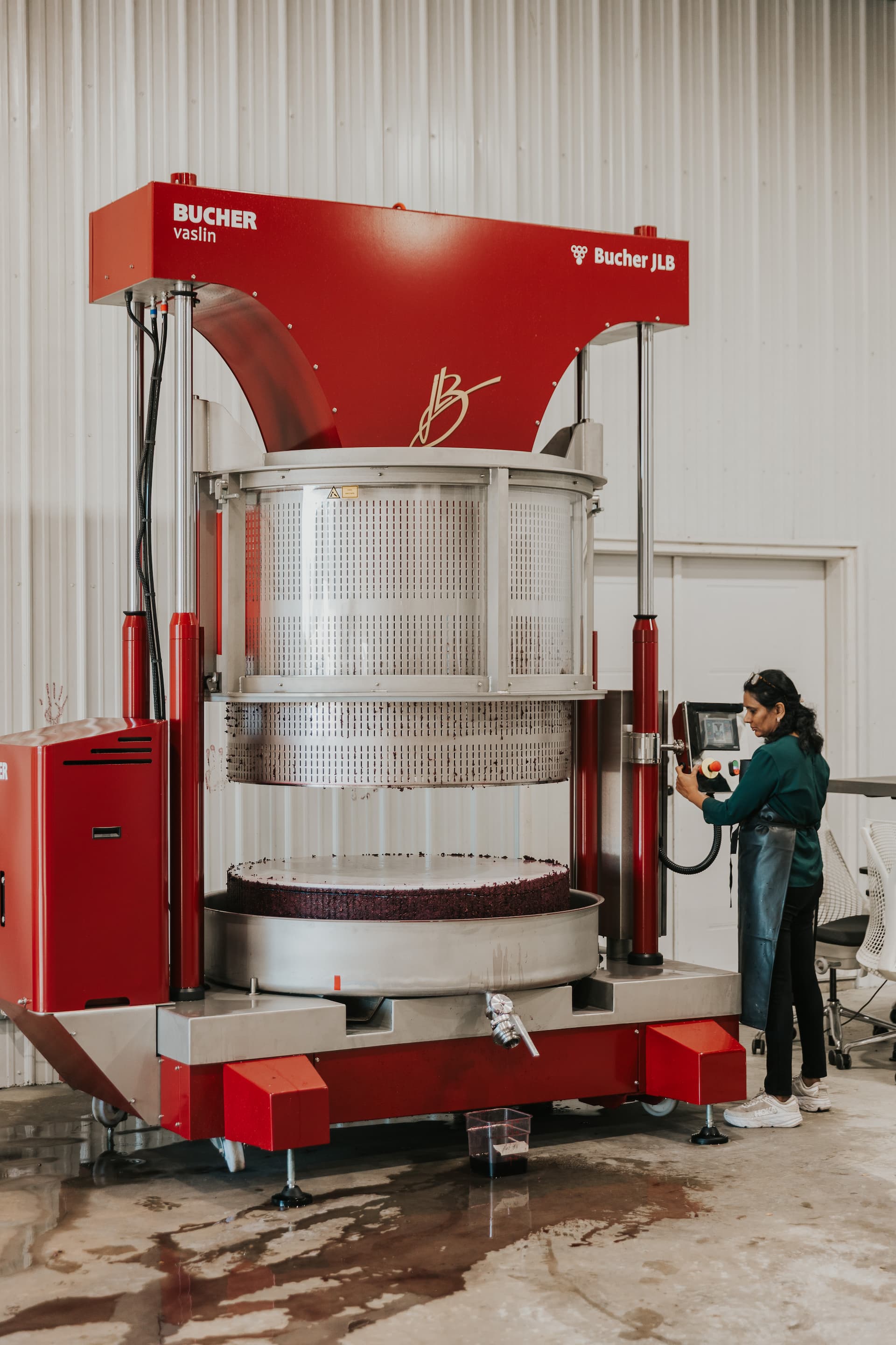 The basket press at work — Tranquility Farm & Winery